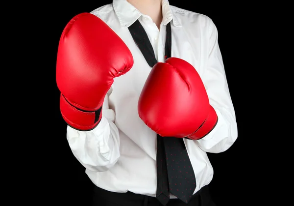 Hombre de negocios en guantes de boxeo aislados en negro —  Fotos de Stock