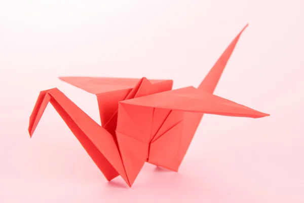 Origami crane on pink background — Stock Photo, Image