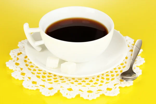 A cup of strong coffee on yellow background — Stock Photo, Image