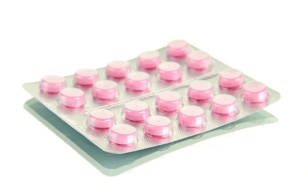 Таблетки, упаковані в пухирі, ізольовані на білому — стокове фото