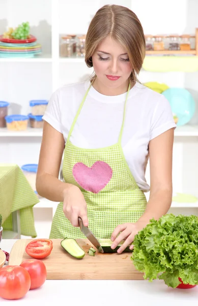 A young girl in kitchen while cooking — Stock Photo, Image