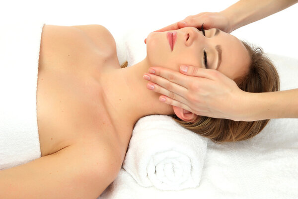 Portrait of beautiful woman taking head massage