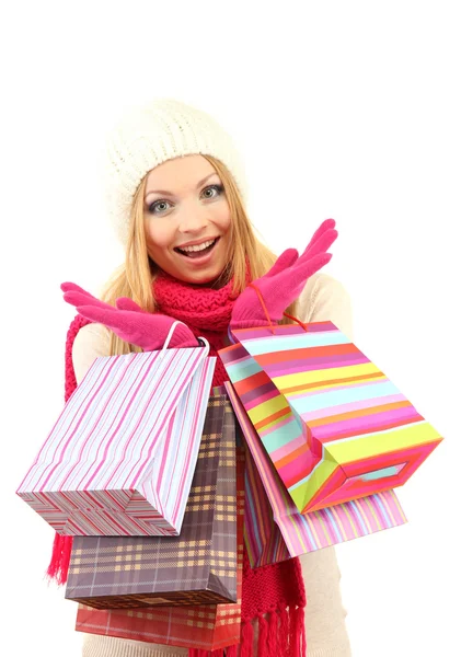 Mujer joven atractiva con muchas bolsas de compras, aislada en blanco — Foto de Stock