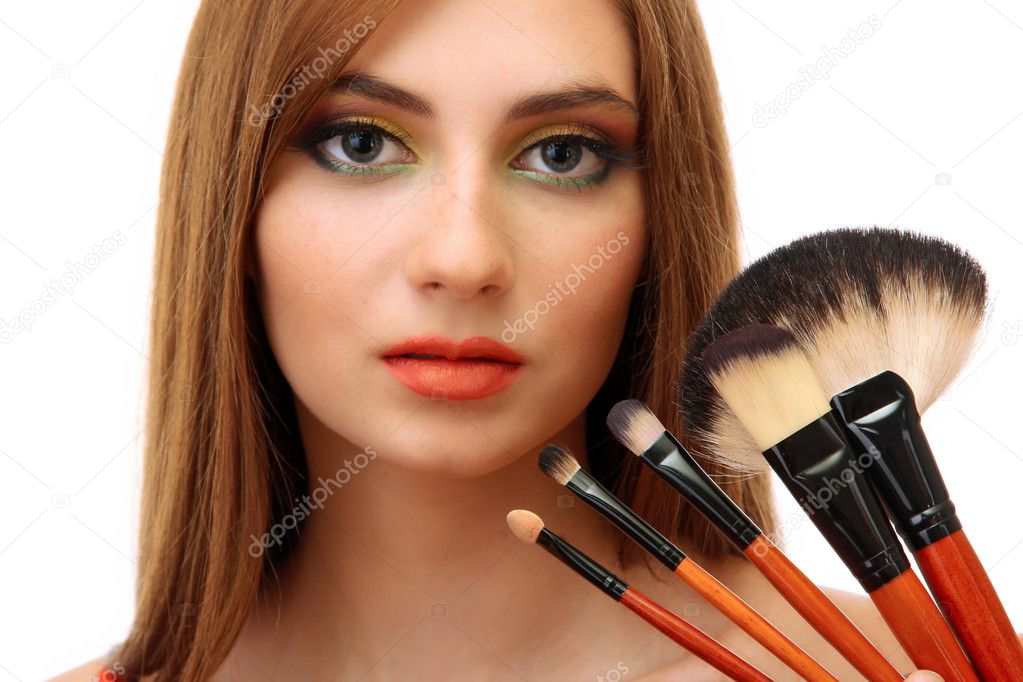 portrait of beautiful woman with make-up brushes, isolated on white