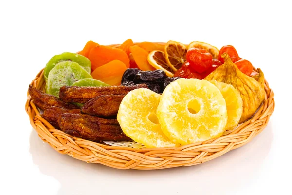 Dried fruits on wicker plate isolated on white — Stock Photo, Image