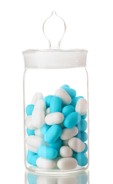 Transparante fles met pillen geïsoleerd op wit — Stockfoto