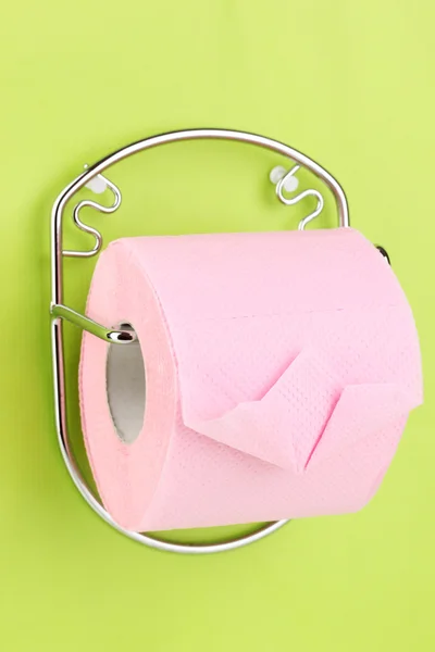 Roll of toilet paper on holder fixed to wall — Stock Photo, Image