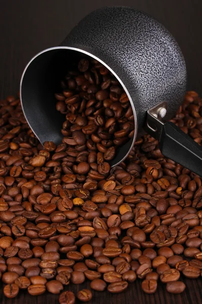 Coffee beans poured from turk — Stock Photo, Image