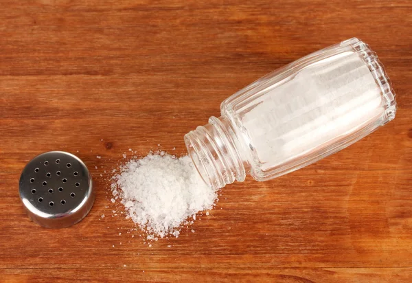 Salt sprinkled on table — Stock Photo, Image