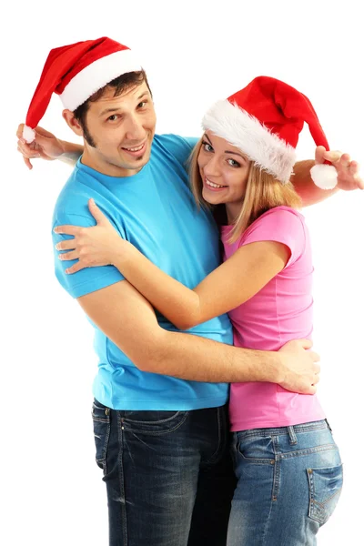 Casal amoroso em chapéus de Papai Noel isolado em branco — Fotografia de Stock