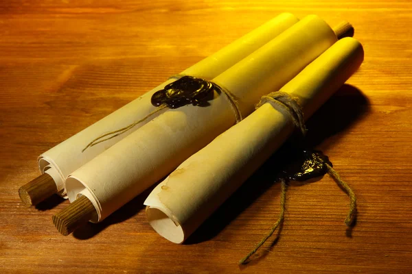 Old scrolls, on wooden background — Stock Photo, Image