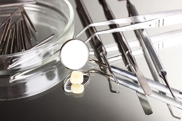 Set of dental tools for teeth care isolated on grey background — Stock Photo, Image