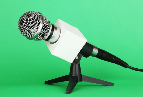 Microphone on stand on green background — Stock Photo, Image