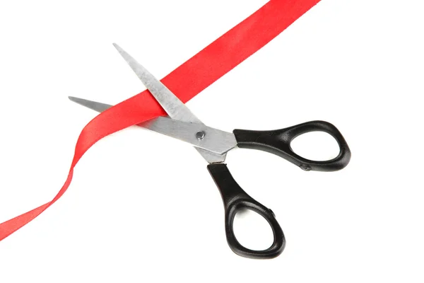 Cutting red ribbon isolated on white — Stock Photo, Image