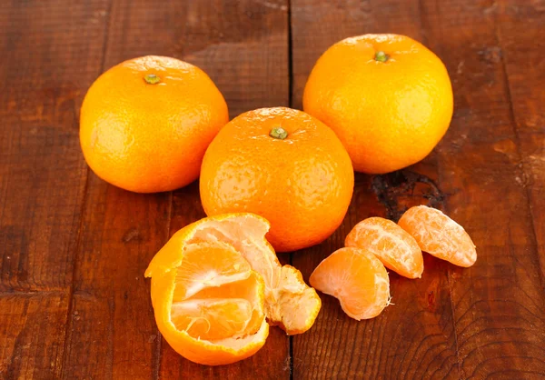 Tasty mandarines on wooden background — Stock Photo, Image