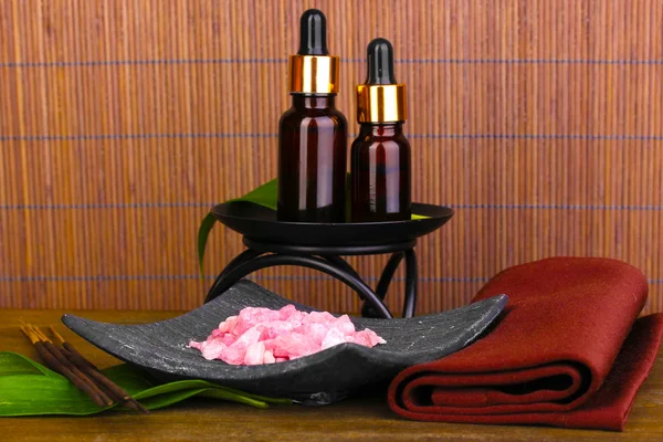 Aromatherapy setting on brown bamboo background — Stock Photo, Image