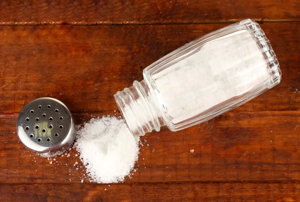 Salt sprinkled on table — Stock Photo, Image