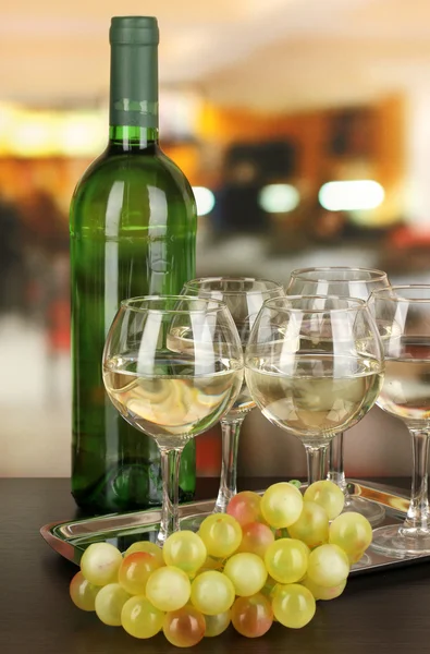 White wine in glass and bottle on room background — Stock Photo, Image