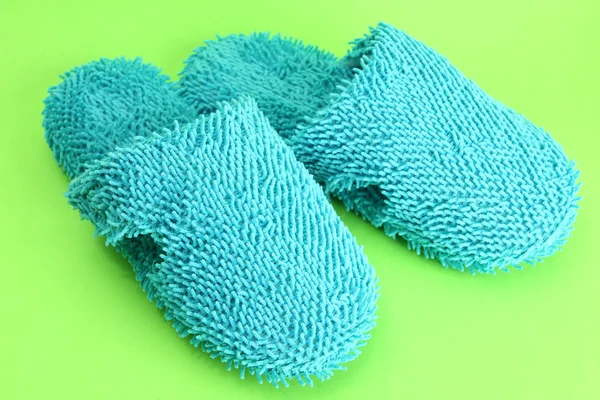 Bright slippers, on green background — Stock Photo, Image