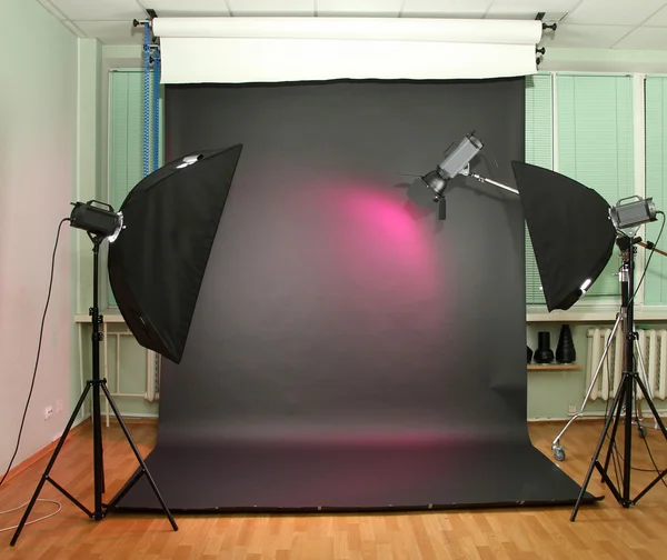 Empty photo studio with lighting equipment — Stock Photo, Image