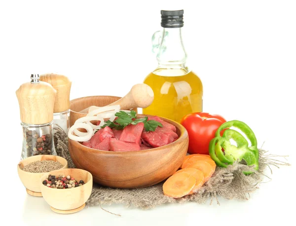 Raw beef meat in bowl with herbs, spices and cooking oil isolated on white — Stock Photo, Image