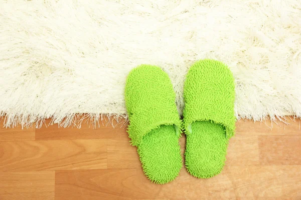 Bright slippers, on floor background — Stock Photo, Image