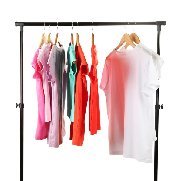 Choice of clothes of different colors on wooden hangers, isolated on white — Stock Photo, Image