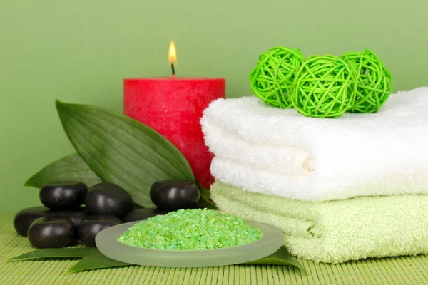 Beautiful spa setting on green background — Stock Photo, Image