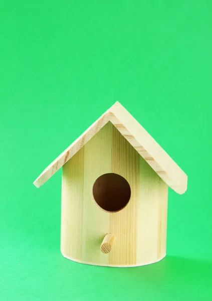 Nesting box on color background — Zdjęcie stockowe