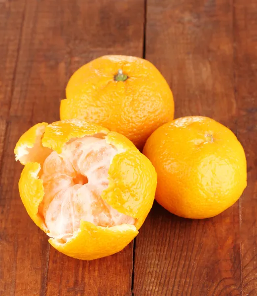 Tasty mandarines on wooden background — Stock Photo, Image