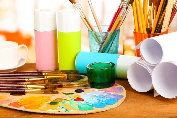 Artistic equipment: paint, brushes and art palette — Stock Photo, Image