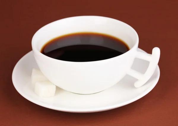 A cup of strong coffee on brown background — Stock Photo, Image