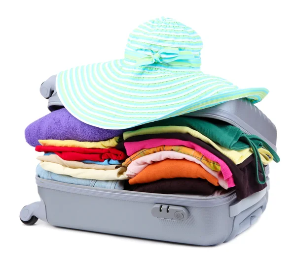 Closed silver suitcase with clothing isolated on white — Stock Photo, Image