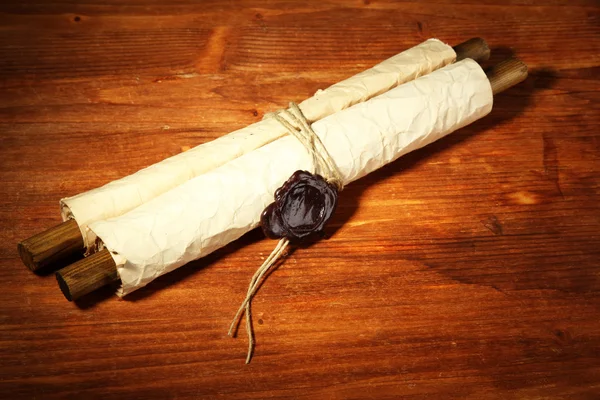 Old scroll, on wooden background — Stock Photo, Image