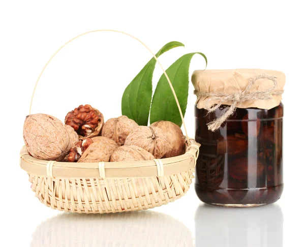 Jam-jar of walnuts and a basket with walnuts — Stock Photo, Image