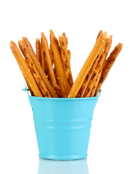 Tasty crispy sticks in blue pail isolated on white — Stock Photo, Image