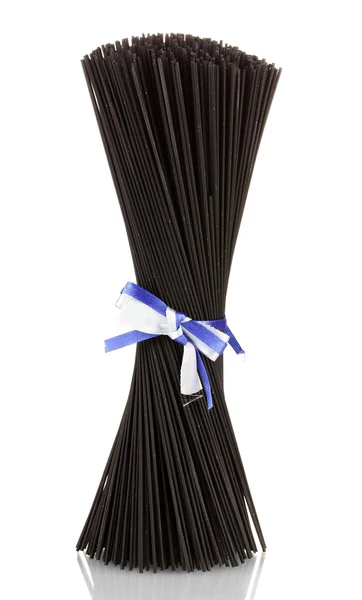 Black spaghetti with ribbon isolated on white — Stock Photo, Image