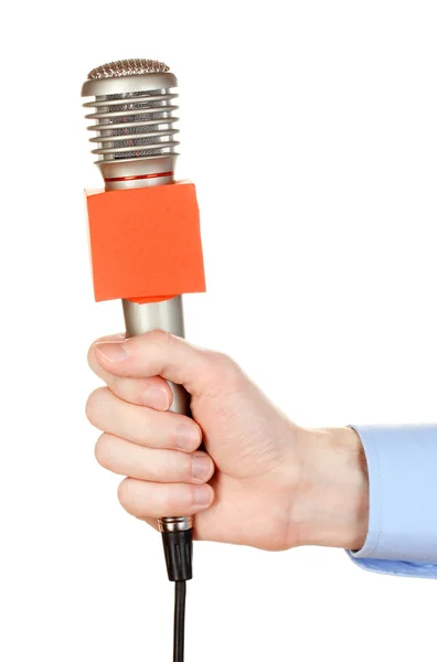 Erkek el ile üzerine beyaz izole mikrofon — Stok fotoğraf