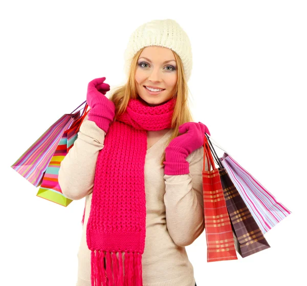 Mujer joven atractiva con muchas bolsas de compras, aislada en blanco —  Fotos de Stock