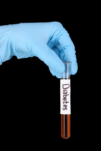 Tubo di prova etichettato Diabete in mano isolato su nero — Foto Stock