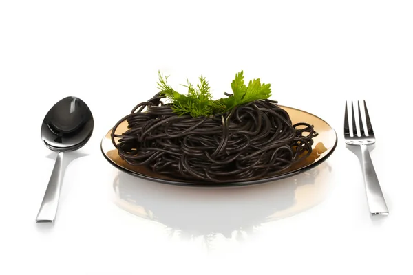 Black spaghetti isolated on white — Stock Photo, Image