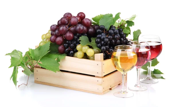 Glasses of wine and assortment of grapes in wooden crate, isolated on white — Stock Photo, Image