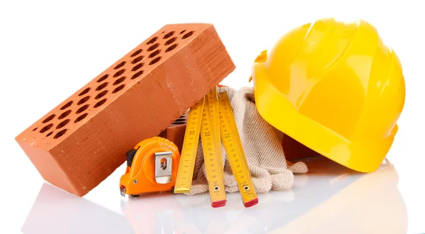 Helmet, roulette, bricks and gloves isolated on white — Stock Photo, Image