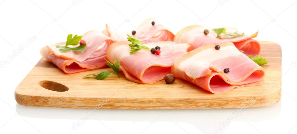 tasty bacon with spices on wooden cutting board, isolated on white
