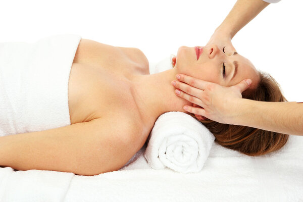 Portrait of beautiful woman taking head massage, isolated on white