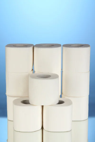 Rolls of toilet paper on blue background — Stock Photo, Image