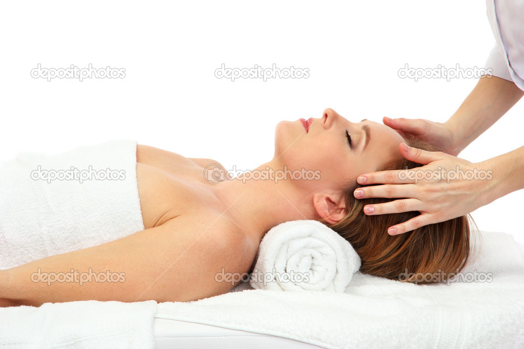 Portrait of beautiful woman taking head massage, isolated on white