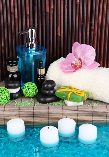 Beautiful spa setting near pool on bamboo background — Stock Photo, Image