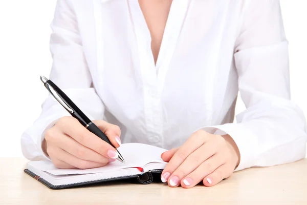 Primer plano de las manos de la mujer de negocios, la escritura en papel — Foto de Stock