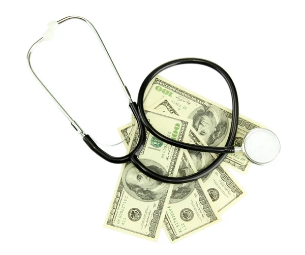 Pojęcie kosztów opieki zdrowotnej: stetoskop i dolarów na białym tle — Zdjęcie stockowe